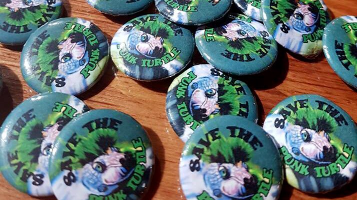Badges with punk turtle images.