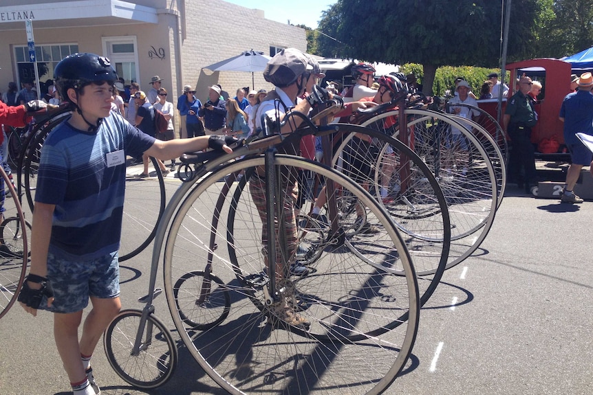 Penny farthing riders in Evandale