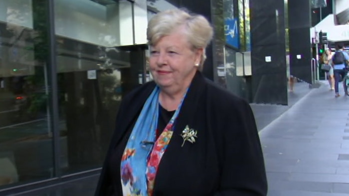 Christine Nixon walks down a Sydney CBD street