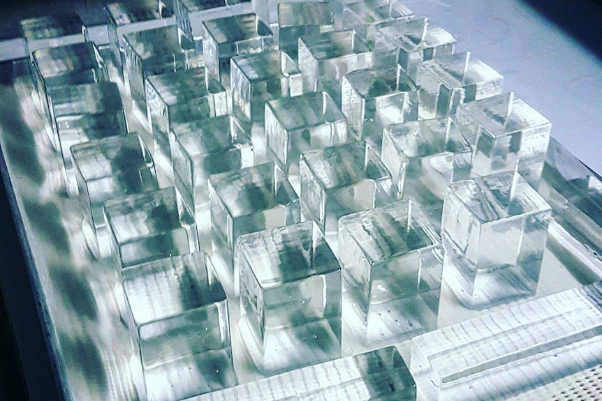 Cubes of clear ice in rows