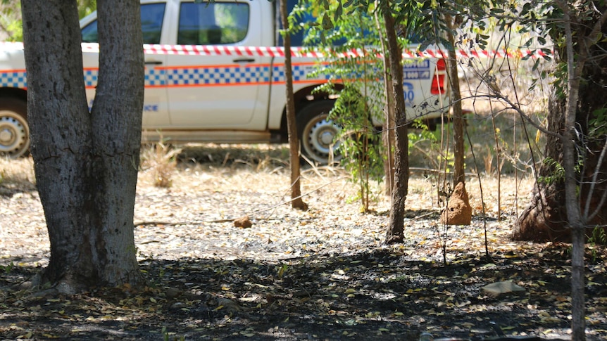 A crime scene in Katherine, surrounded by a police car and red tape.