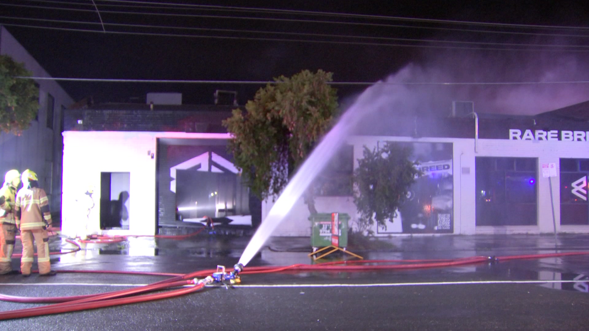 A fire hose at a fire.