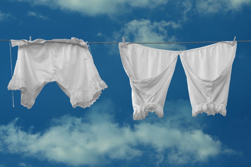 Two pairs of white bloomers on a washing line.