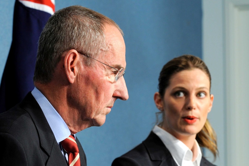 Sports minister Kate Ellis (R) looks to David Crawford at the release of the Crawford Report in 2009.