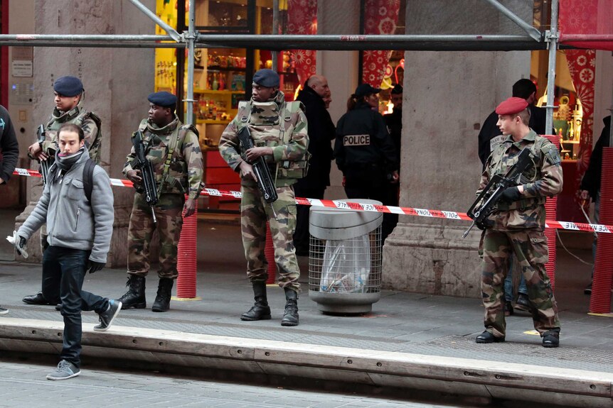 French soldiers on guard outside a Jewish Community centre
