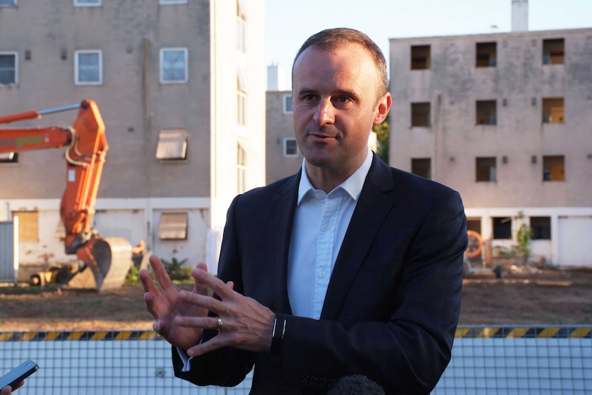 ACT Chief Minister Andrew Barr in front of the Dickson Towers.