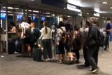 Sydney International Airport hit with overcrowding and long queues as travellers arrive back in Australia