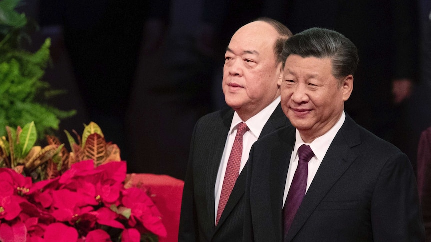 Chinese President Xi Jinping, right, and new Macao Chief Executive Ho Iat Seng