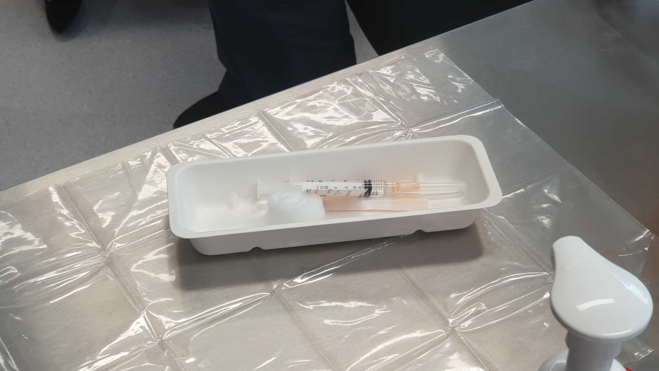 And AstraZeneca vaccination needle ready to be used