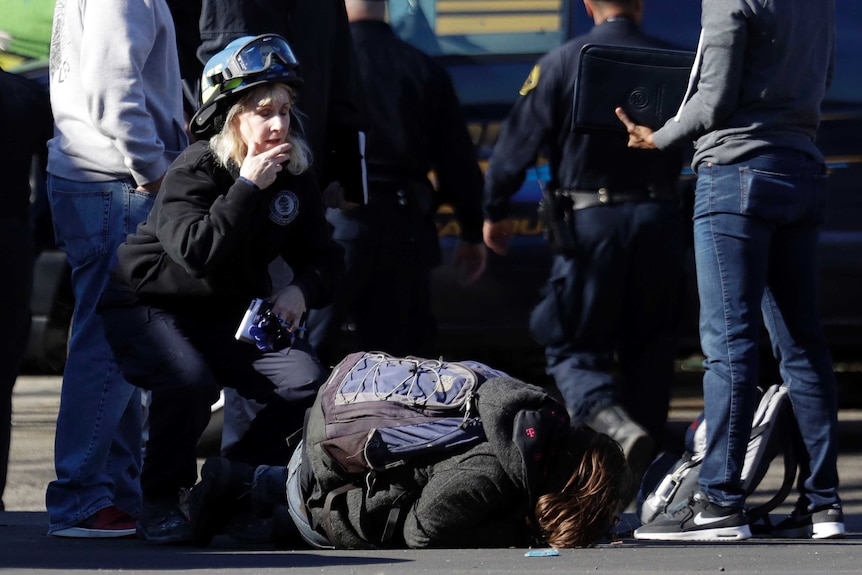 An unidentified man falls to the ground a