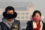 People wear face masks in Beijing