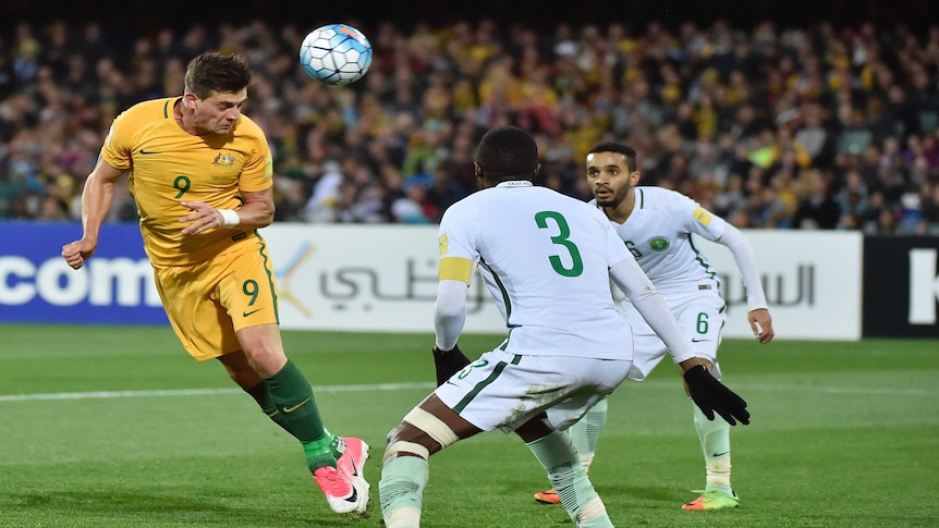 Socceroos' Tomi Juric heads home his second goal against Saudi Arabia