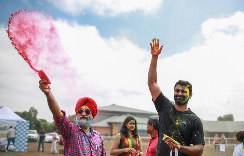 Guri Singh throws coloured powder