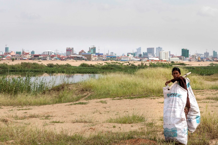 Woman collects rubbish