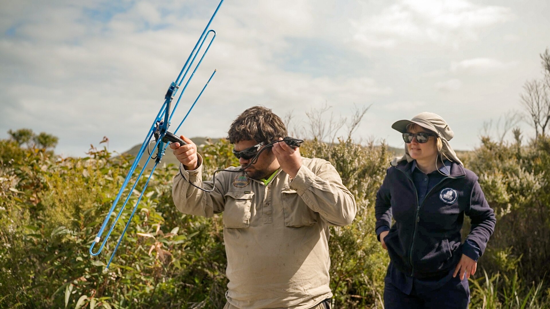 A medium shot of man holding a receiver