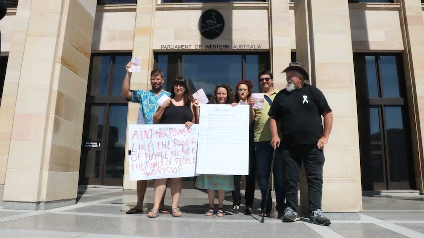 Roe 8 protesters hand back move on notice to Government outside WA Parliament House. December 17, 2015.