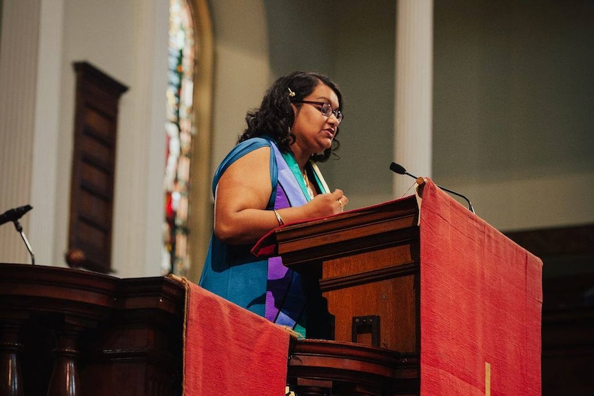 Uniting Church minister Reverend Radhika Sukumar-White speaks from the pulpit.