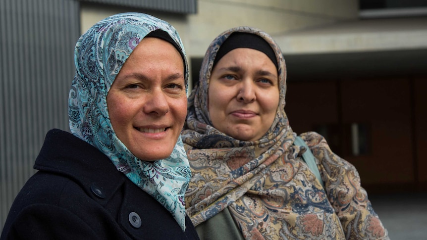 Muslim mwomen Faiza Matthews and Oula Qasim wearing headscarves.