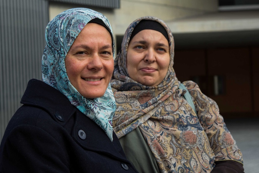 Muslim mwomen Faiza Matthews and Oula Qasim wearing headscarves.