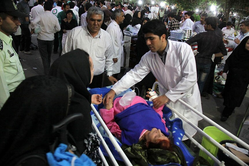 Medics attend to Iraq quake victim