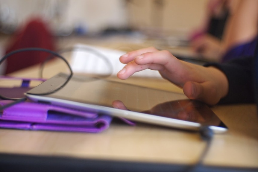 A child using a tablet.