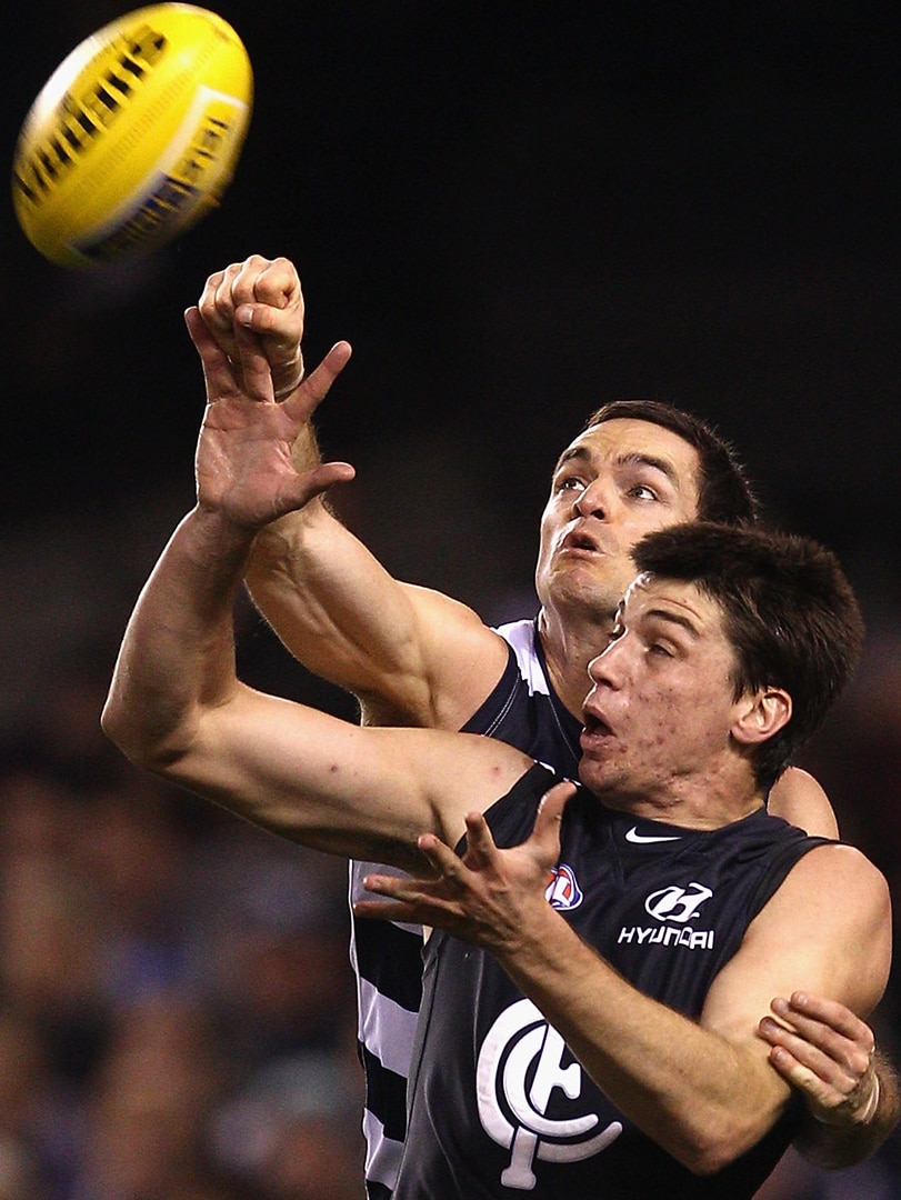 The Cats' Matthew Scarlett and the Blues' Matthew Kreuzer go at it at Docklands.