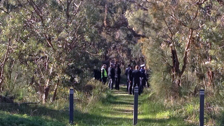 Police and members of the court visit the burial site in Kings Park.