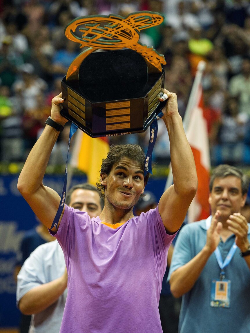 Sao Paulo victory ... Rafael Nadal celebrates with the Brazil Open trophy.