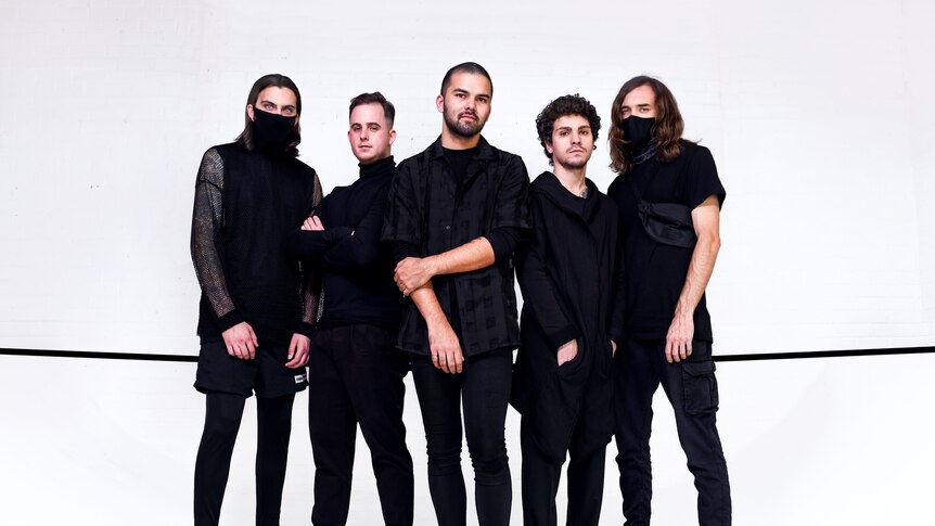 Northlane posed against white background, dressed in black