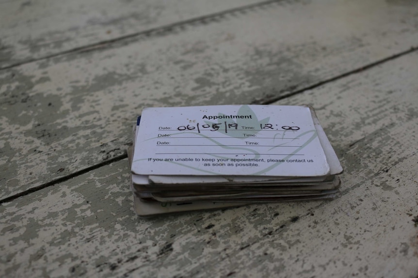 A stack of business cards on a table.