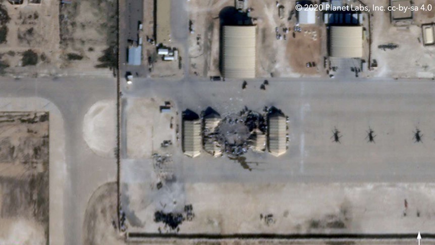 A satellite image of the air base after being hit by the Iranian missile. A large portion looks like black rubble