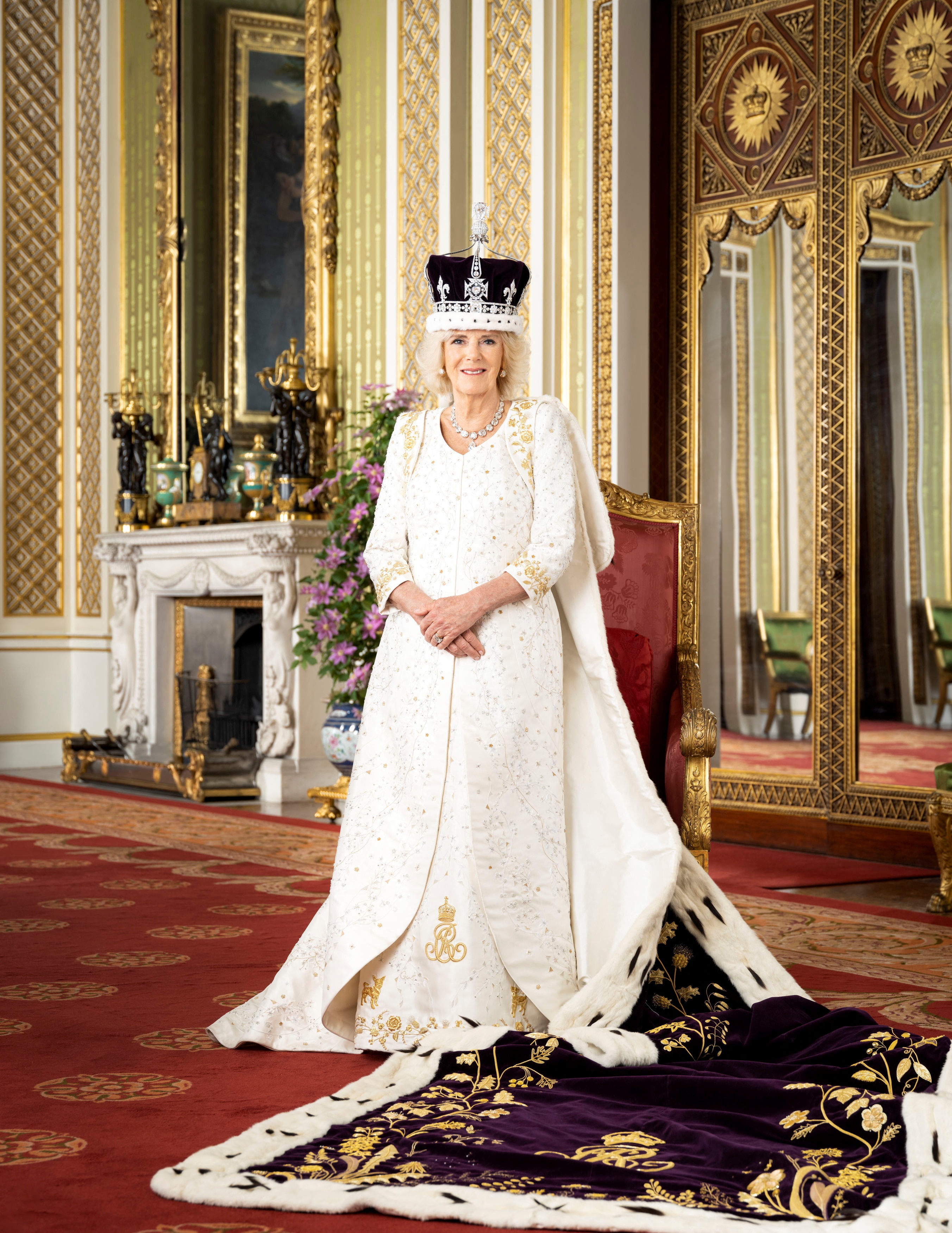 Camilla smiles in her crown and regalia.