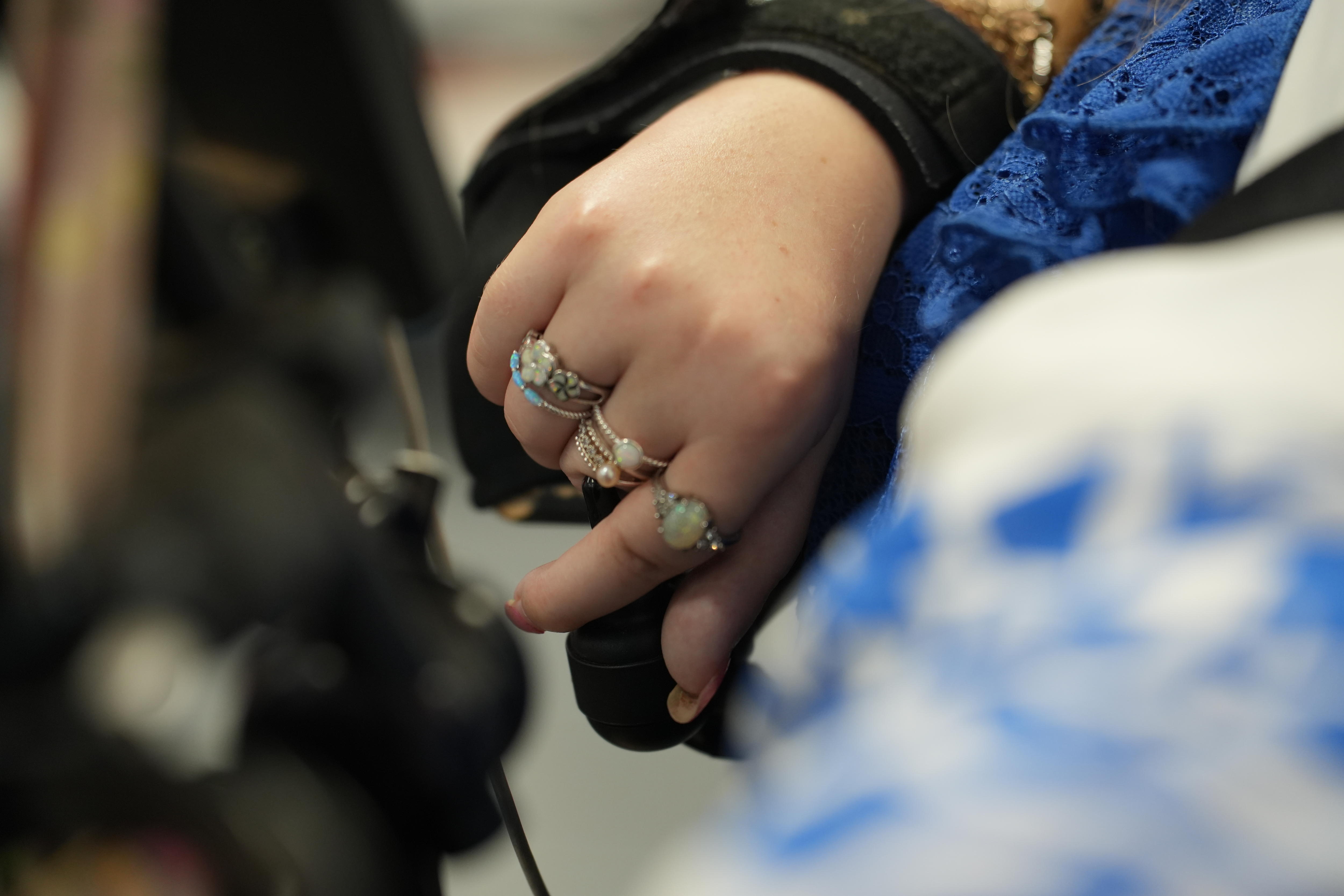 A close to a hand using a joystick.