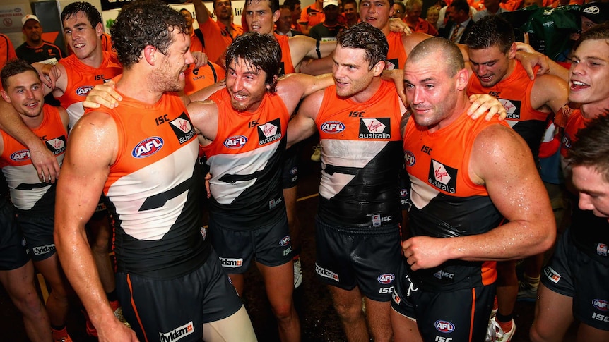 Shane Mumford, Dylan Addison, Heath Shaw and Josh Hunt sing the Giants' song after beating Sydney.