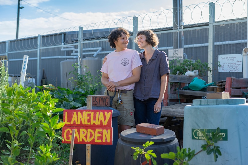 Two women inside a Melbourne community garden where they have a plot, a way to garden while renting.