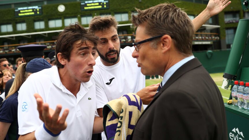 Pablo Cuevas and Marcel Granollers protest at referee