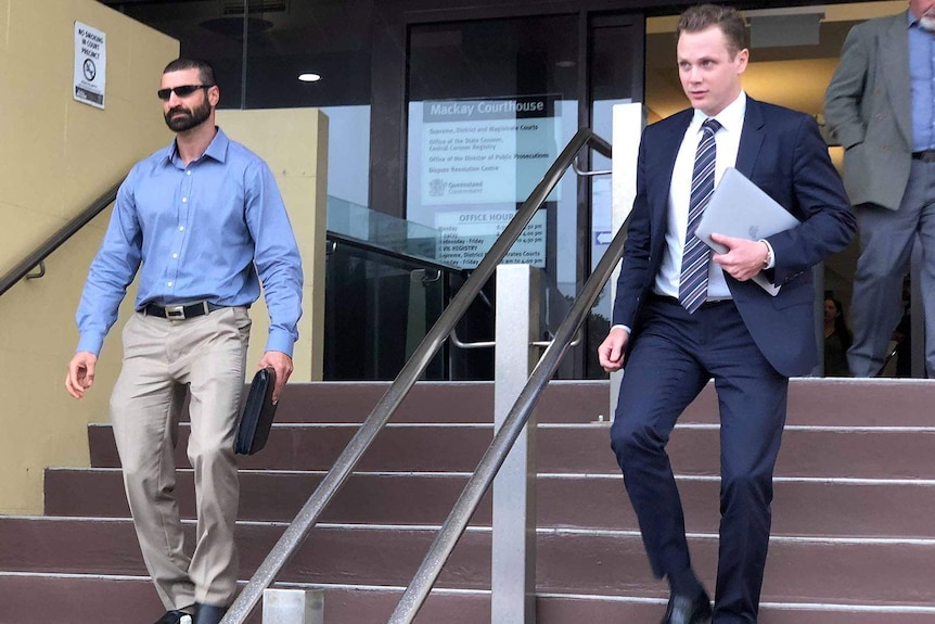 Two men leaving a court house