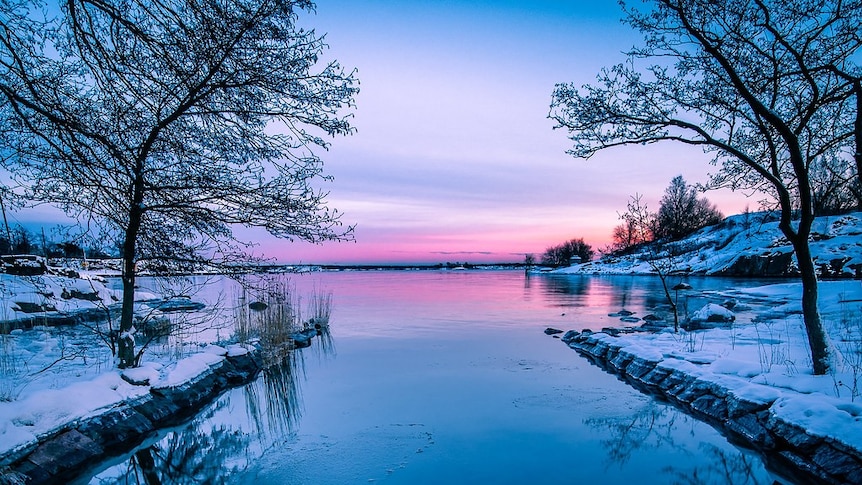 Sunrise over a snow-covered lake in Helsinki