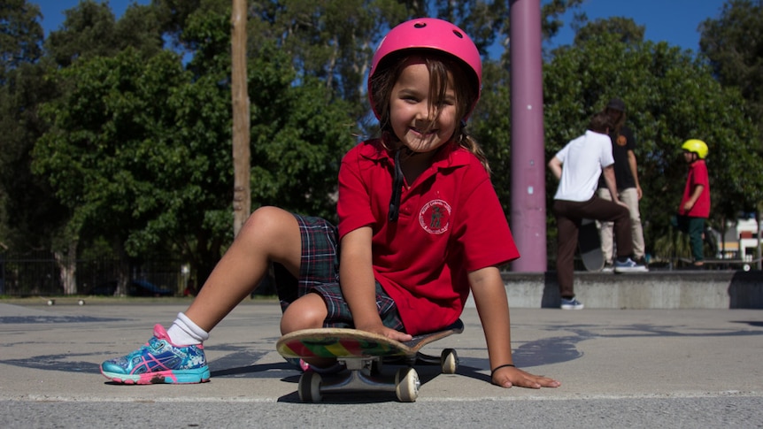Djirilla Haynes sits on her skateboard
