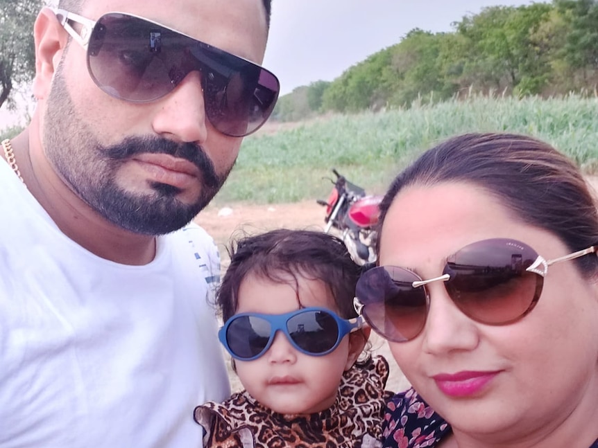 Gurdev Singh with his wife and daughter in India