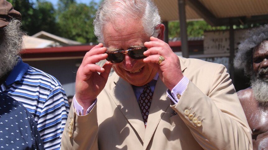 Princes Charles laughing in Nhulunbuy wearing sunglasses.