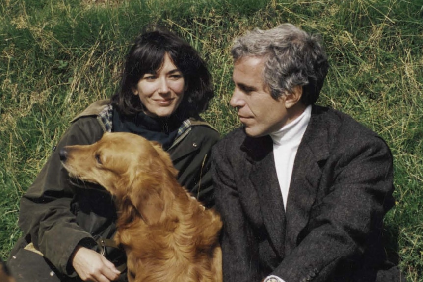 Ghislaine Maxwell and Jeffrey Epstein sit in grass with a golden retriever between them 