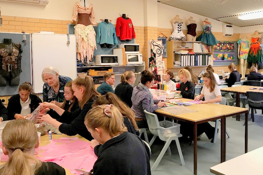 A classroom where teachers or mentors guide students to sew sanitary packs.