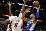 Ben Simmons shoots for the basket against the Heat