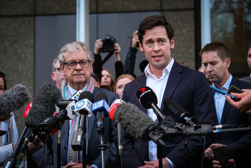 Two men at a press conference