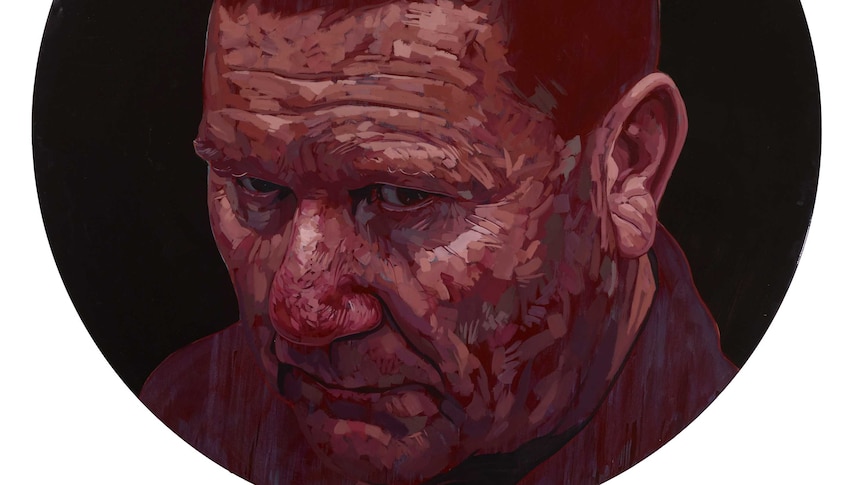 A round portrait of a man in deep red colours.