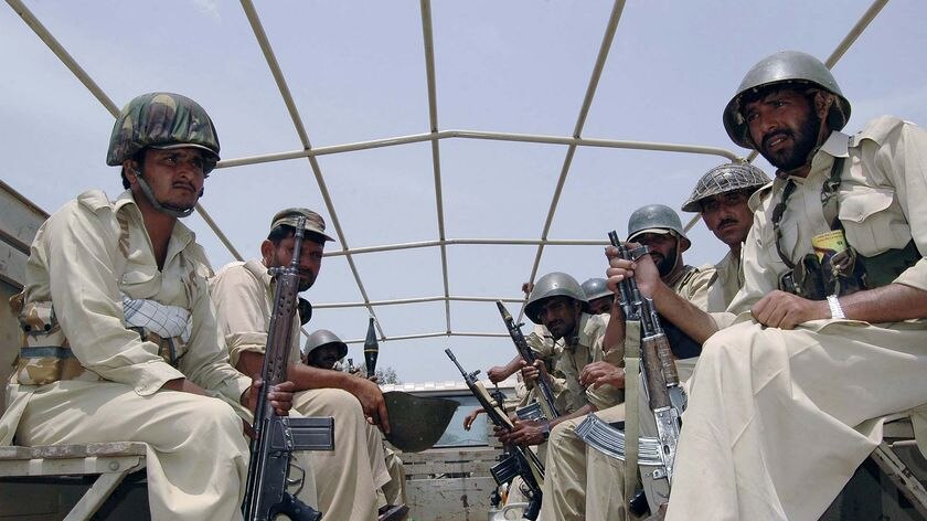 Pakistani paramilitary soldiers patrol the operation area near Bara