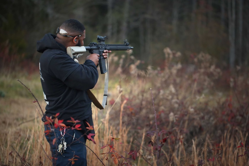 A Redneck Revolt member takes aim at the gun range.