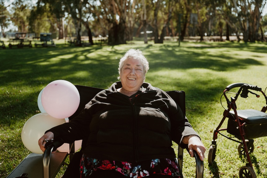 A women with balloons. 