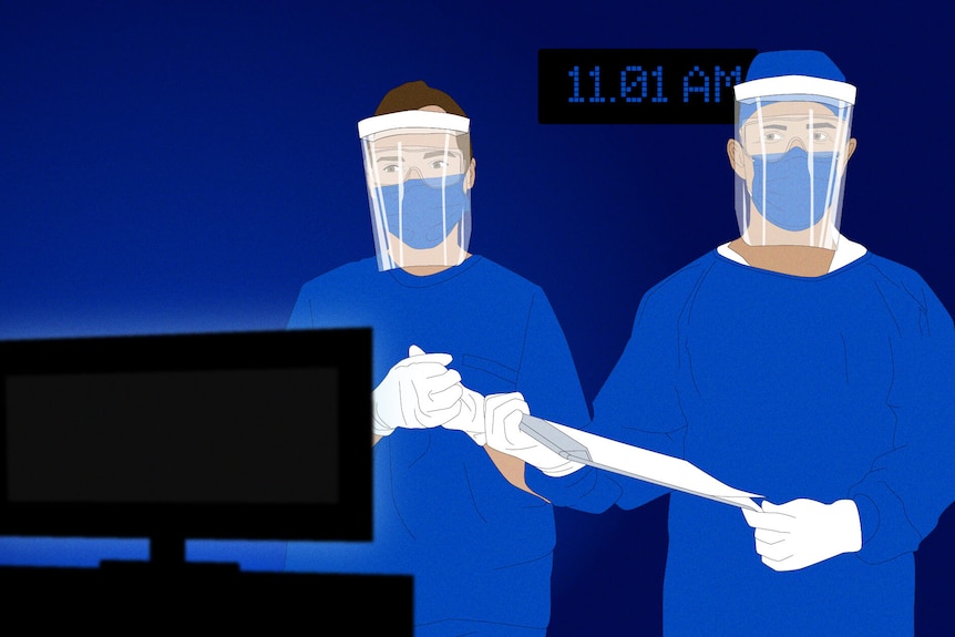 Two healthcare workers in PPE watching a TV